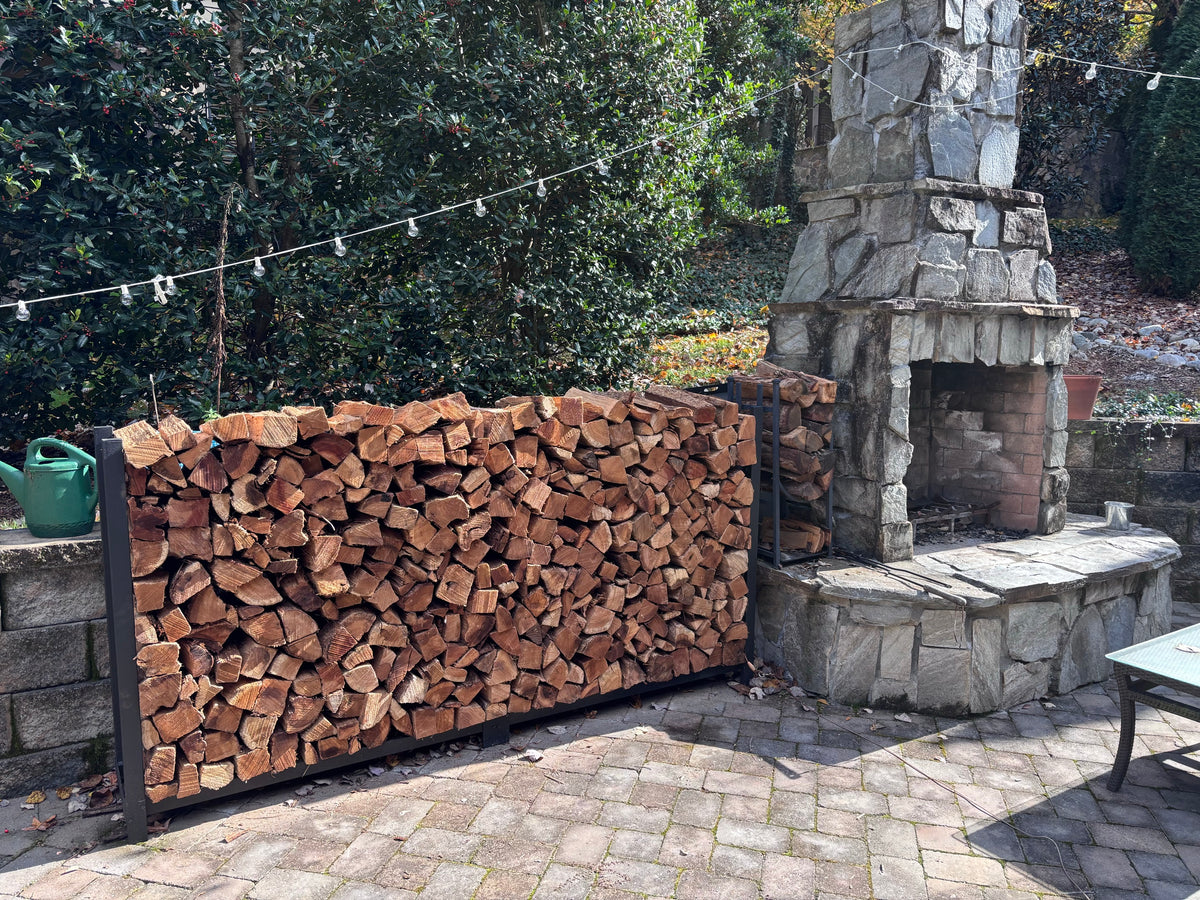 A full rack beside a stone outdoor fireplace