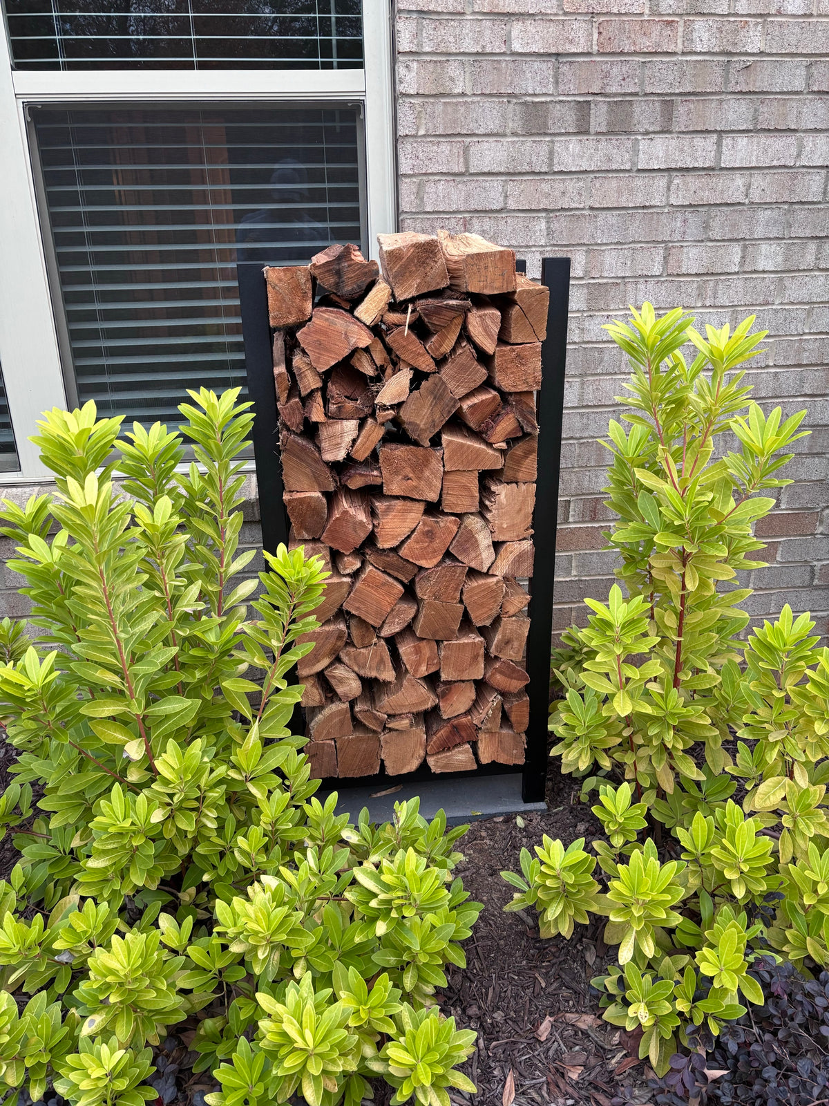 A rack tucked in against the side of a house